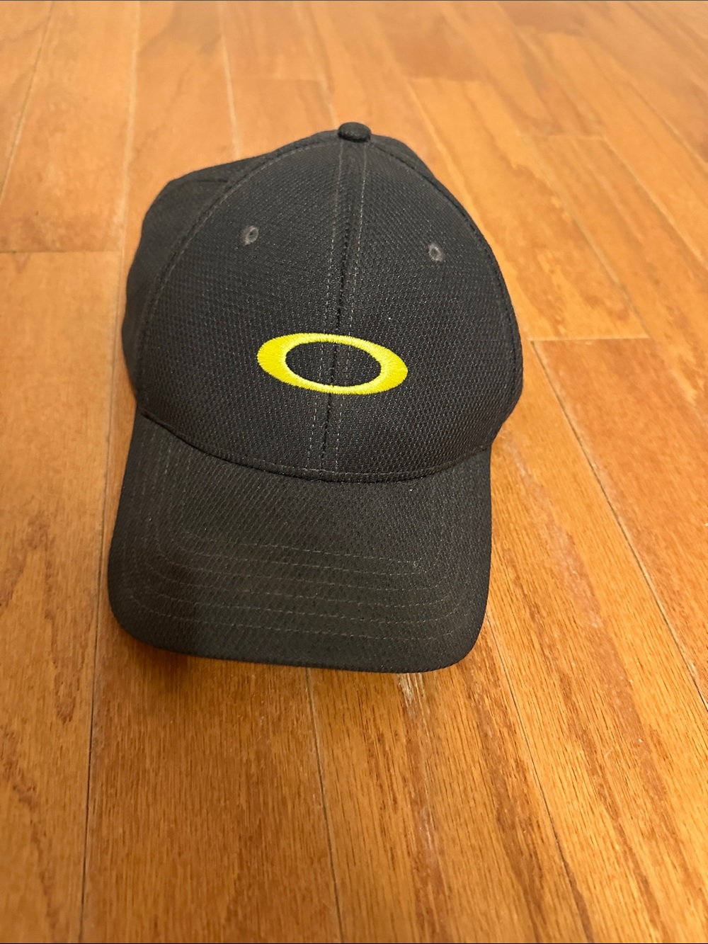 Oakley Dark Gray Baseball Hat with Yellow Oval Logo